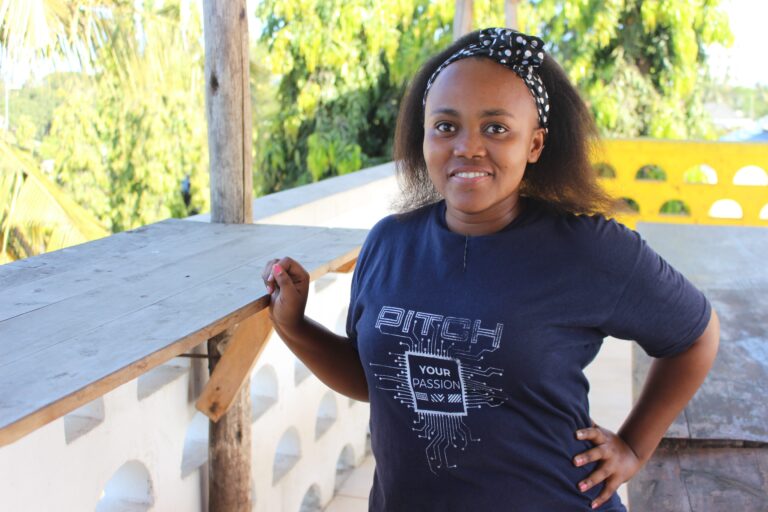 Young woman smiling and looking at camera